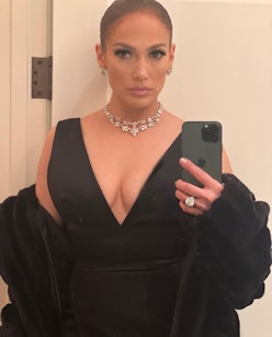 Jennifer Lopez slicked bun taking mirror selfie