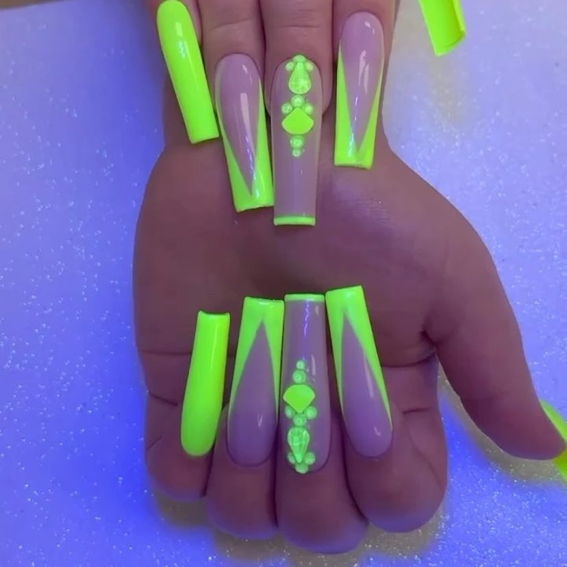 Green neon nails with jewels.
