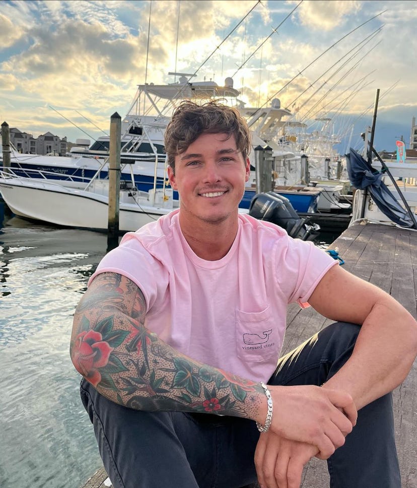 John Henry from 'Bachelor in Paradise' posing in front of a boat. Screenshot via Instagram