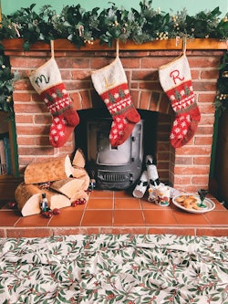 heirloom Christmas stockings on a mantel