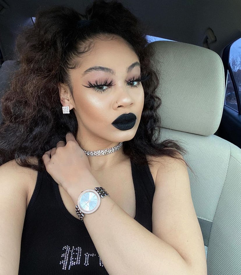 A Wednesday Addams makeup idea for Halloween 2023 with spider lashes & black lipstick.