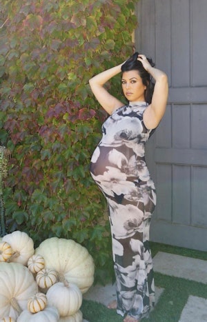 Kourtney kardashian wearing mesh dress outside her home in Calabasas posted on Instagram.