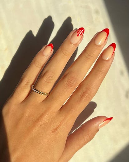 Red French tips trendy Halloween nail design for 2023.