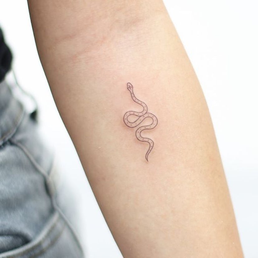 Aries wants an edgy tattoo design, like a snake or flames.