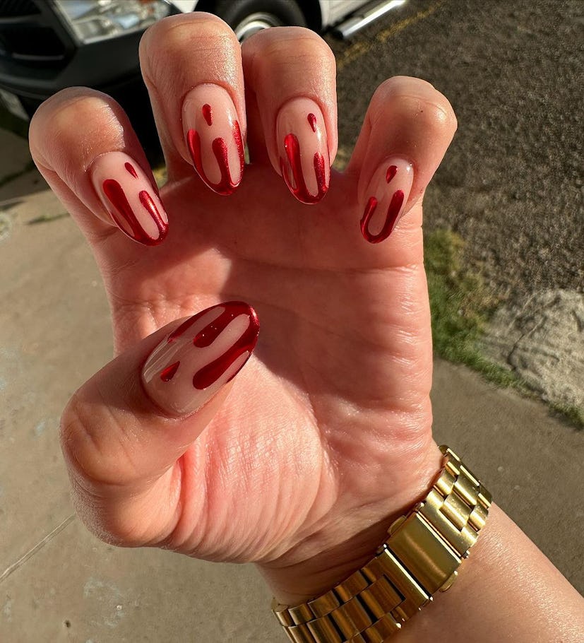 For simple Halloween nails,  red chrome blood drop nail art is on-trend for 2023 and good for short ...