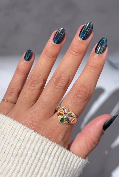 Black chrome nails are going to be a popular winter 2024 nail color trend.