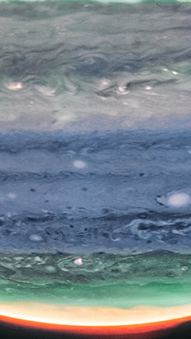 Eerie and soft cloudy bands cross the face of Jupiter. A broad hazy belt sits near the center of the...