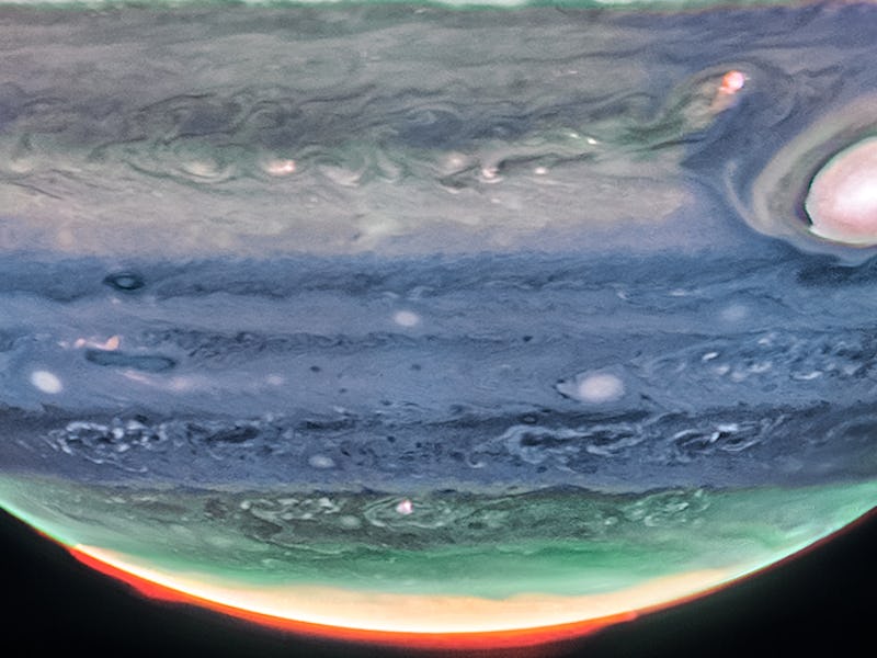 Eerie and soft cloudy bands cross the face of Jupiter. A broad hazy belt sits near the center of the...