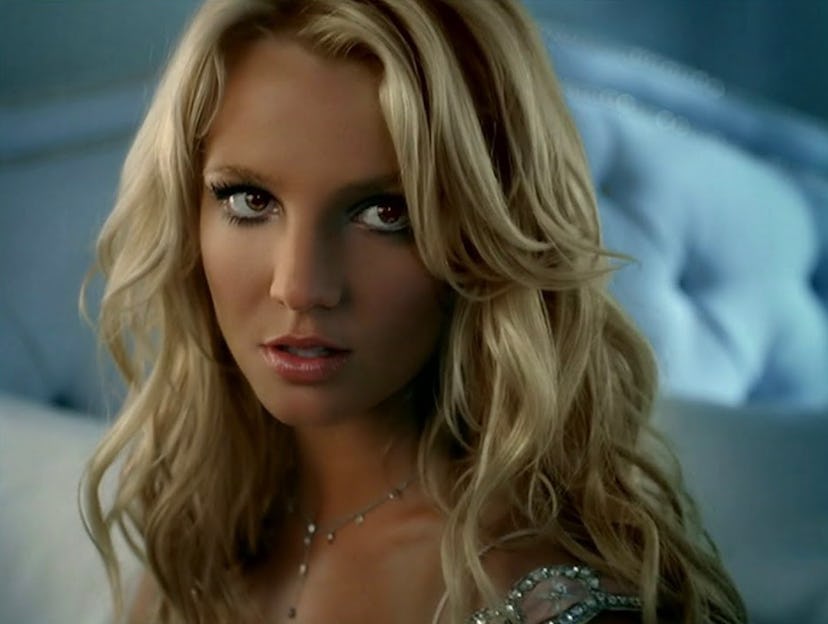 Britney Spears curls in Curious perfume commercial