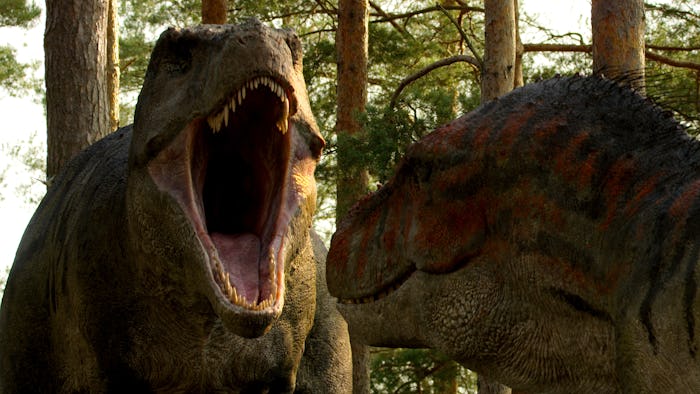 A dinosaur roaring at another dinosaur in 'Life On Our Planet,' narrated by Morgan Freeman.