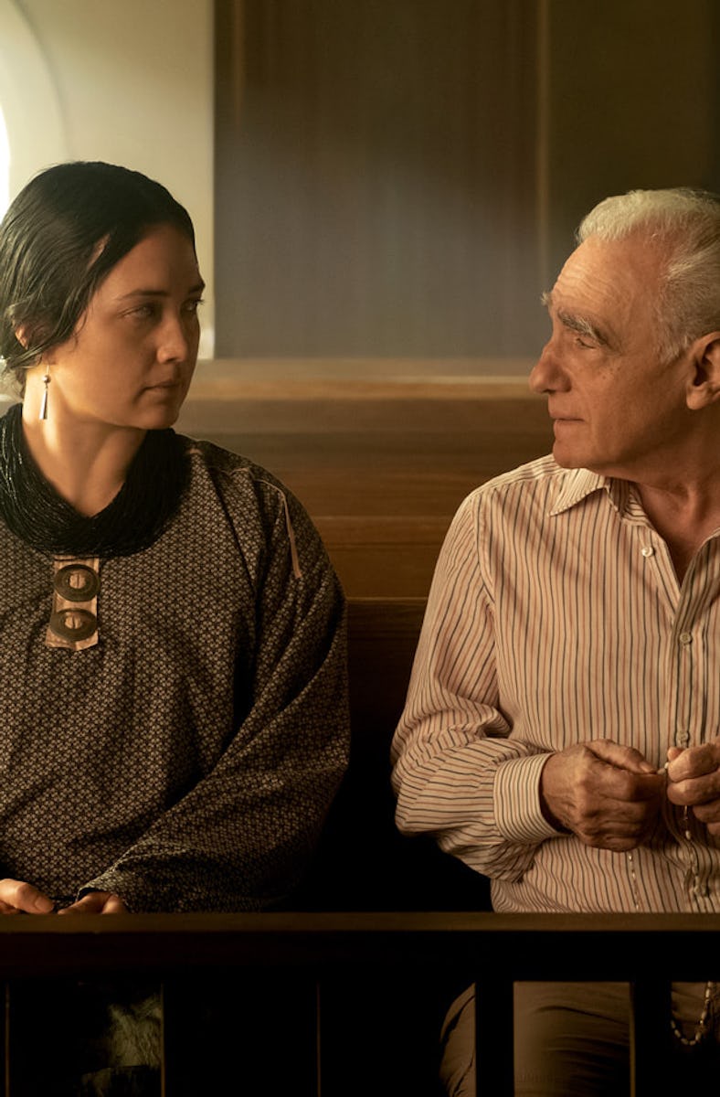 Lily Gladstone and Martin Scorsese sit together on the set of 'Killers of the Flower Moon'