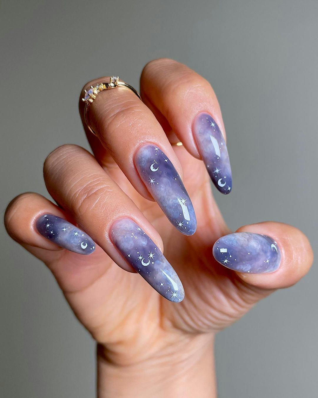A star &amp; moon nail art design for scorpio season 2023 manicure ideas.
