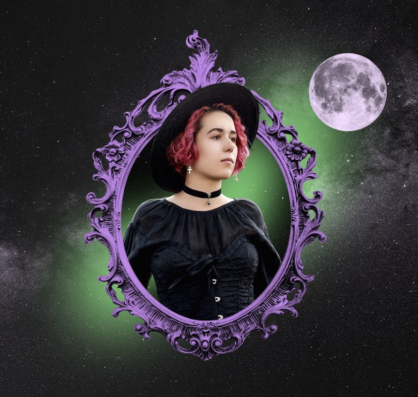 Young woman in costume reading her Halloween 2023 horoscope.