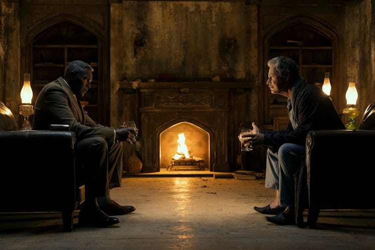 Carl Lumbly and Bruce Greenwood sit across from each other in 'The Fall of the House of Usher'