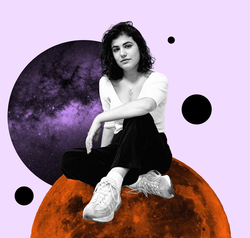 Young woman sitting on a planet for your November 2023 monthly horoscope.
