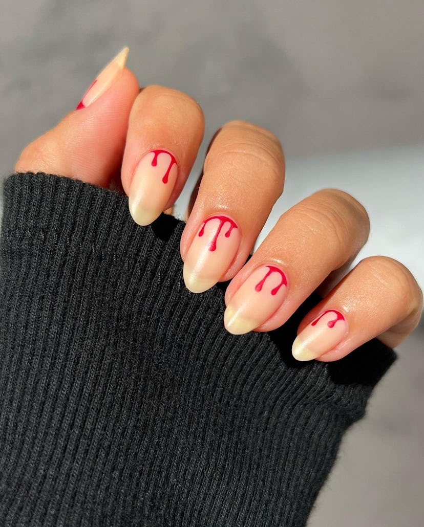 A blood drip nail art design that’s inspired by “Bad Blood” on 1989 (Taylor’s Version).