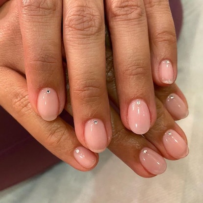 Tia Mowry pink nude nails with gems