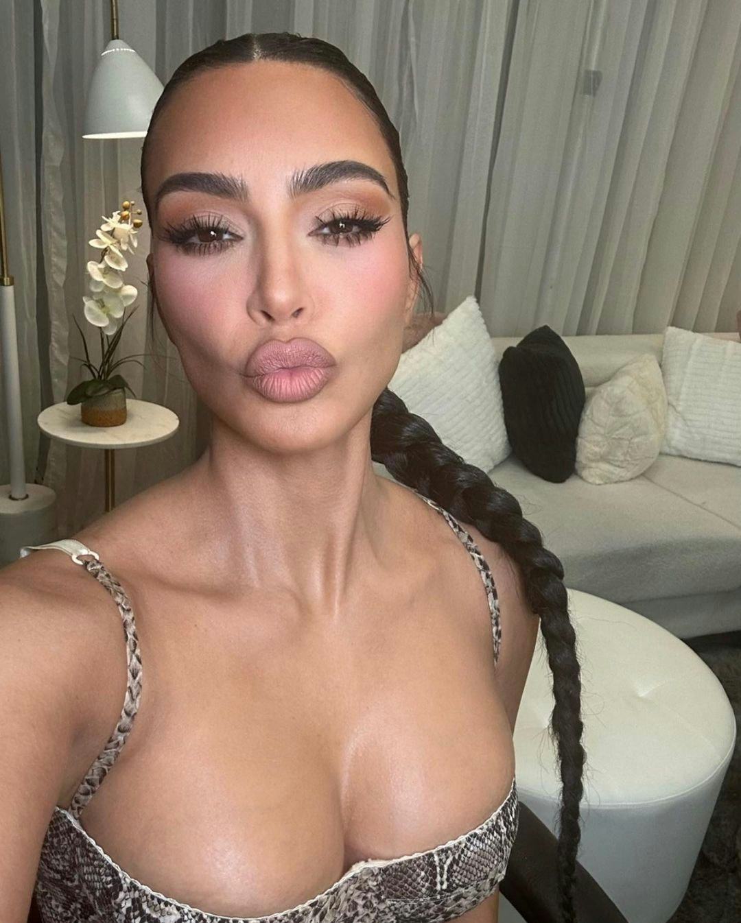 Kim Kardashian&rsquo;s long braid is a cute &amp; easy hairstyle for greasy hair that hides oily roots.