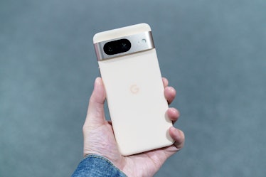 Hand holding the Pixel 8 showing two rear cameras.
