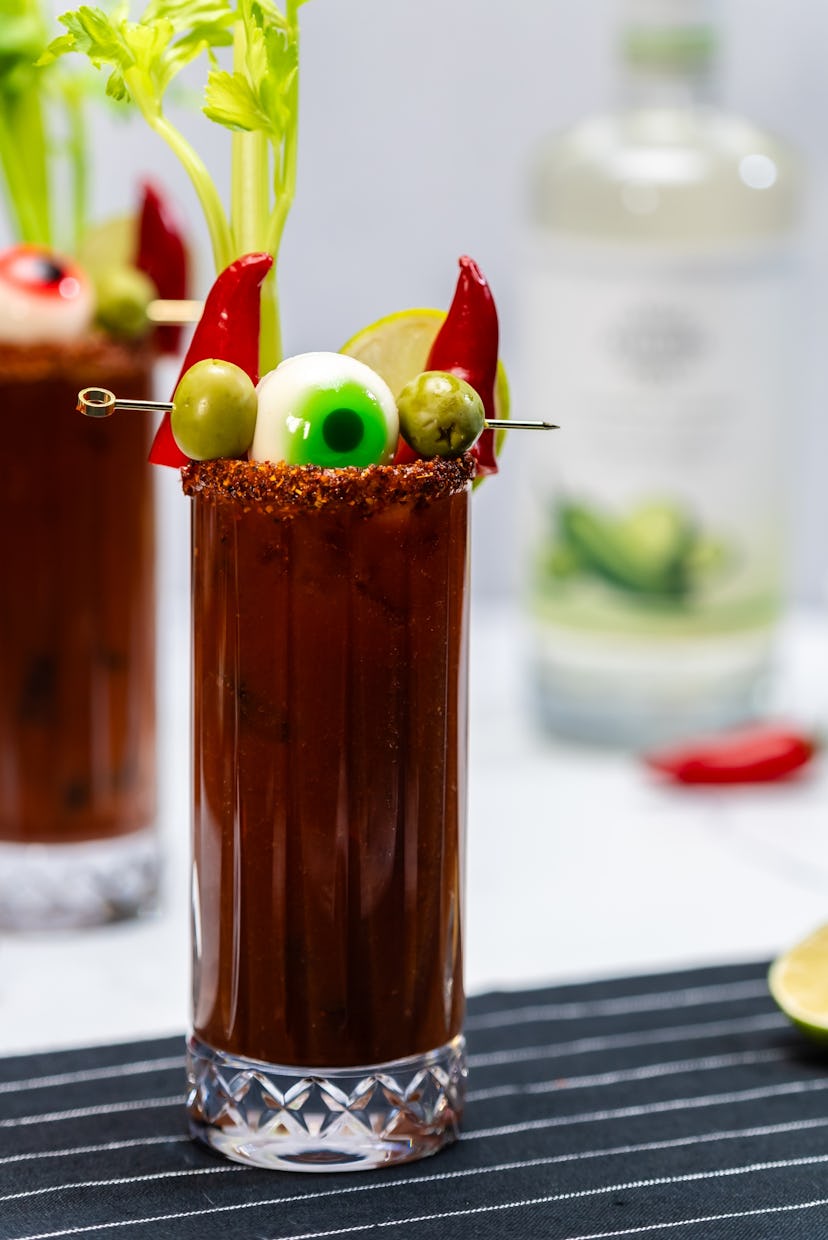 An easy Halloween cocktail, a spicy bloody mary with chili pepper horns garnish