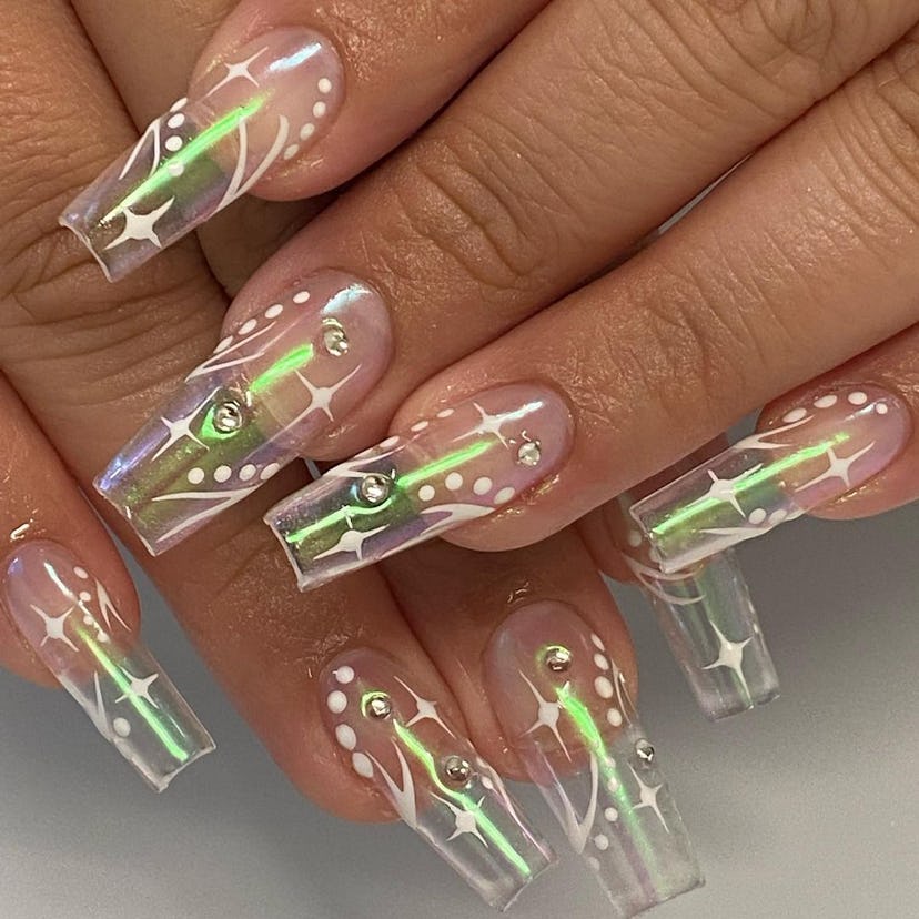Long clear nails with a green holographic shine.