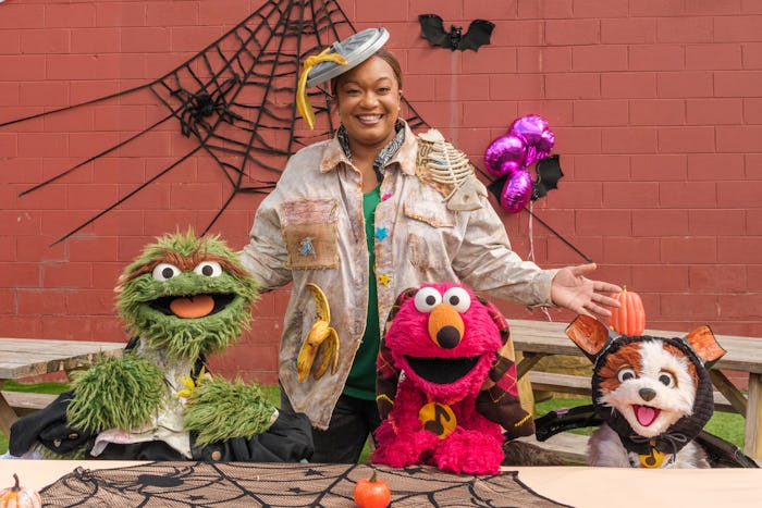 Sunny Anderson and Oscar the Grouch in the new Sesame Street Halloween special. 