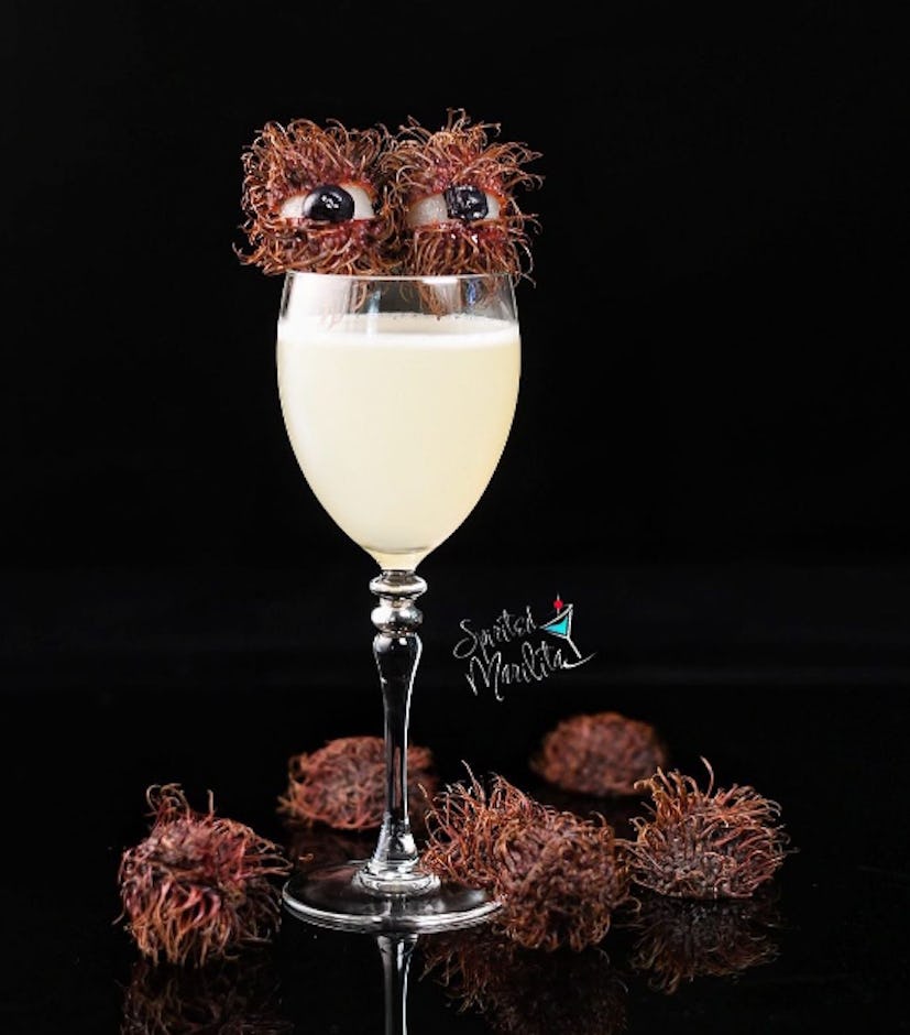 Halloween cocktails with rambutan eyeball garnish