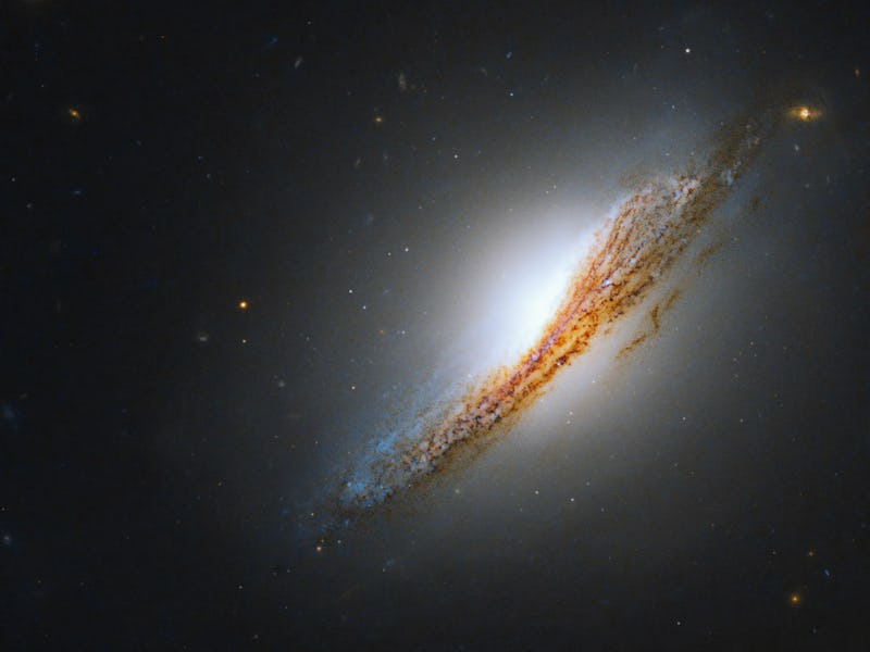 Lenticular, radio galaxy NGC 612 is seen edge-on in this new image from the Hubble Space Telescope.