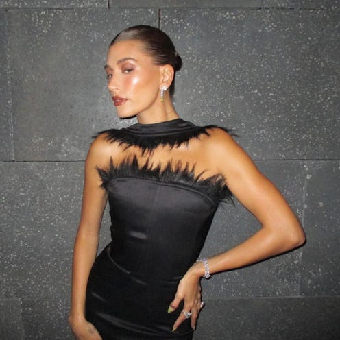Hailey Bieber slicked bun and yellow nails