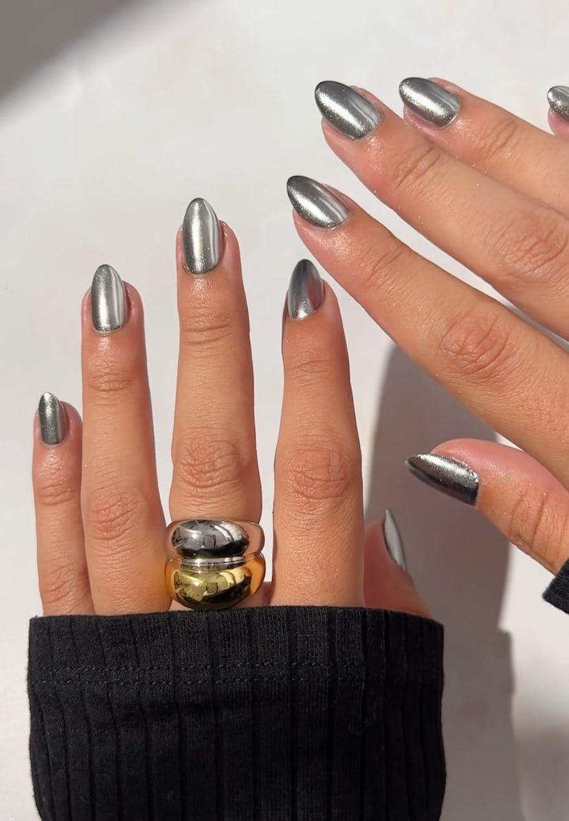 One of the most popular winter nail polish color trends for 2024 is metallic silver chrome.