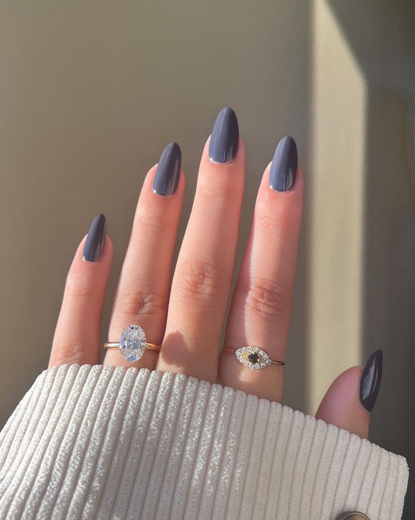 One of the most popular winter nail polish color trends for 2024 is dark slate gray.