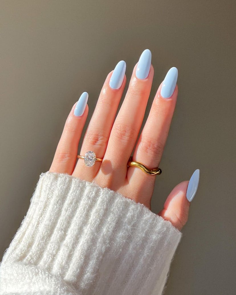 One of the most popular winter nail polish color trends for 2024 is light icy blue.
