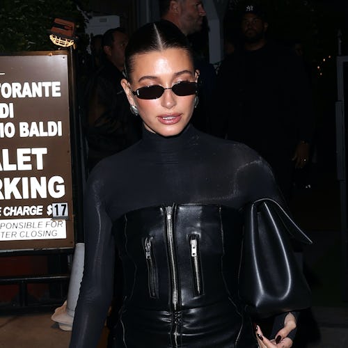 Hailey Bieber wears a strapless leather mini dress from kylie jenner’s brand khy