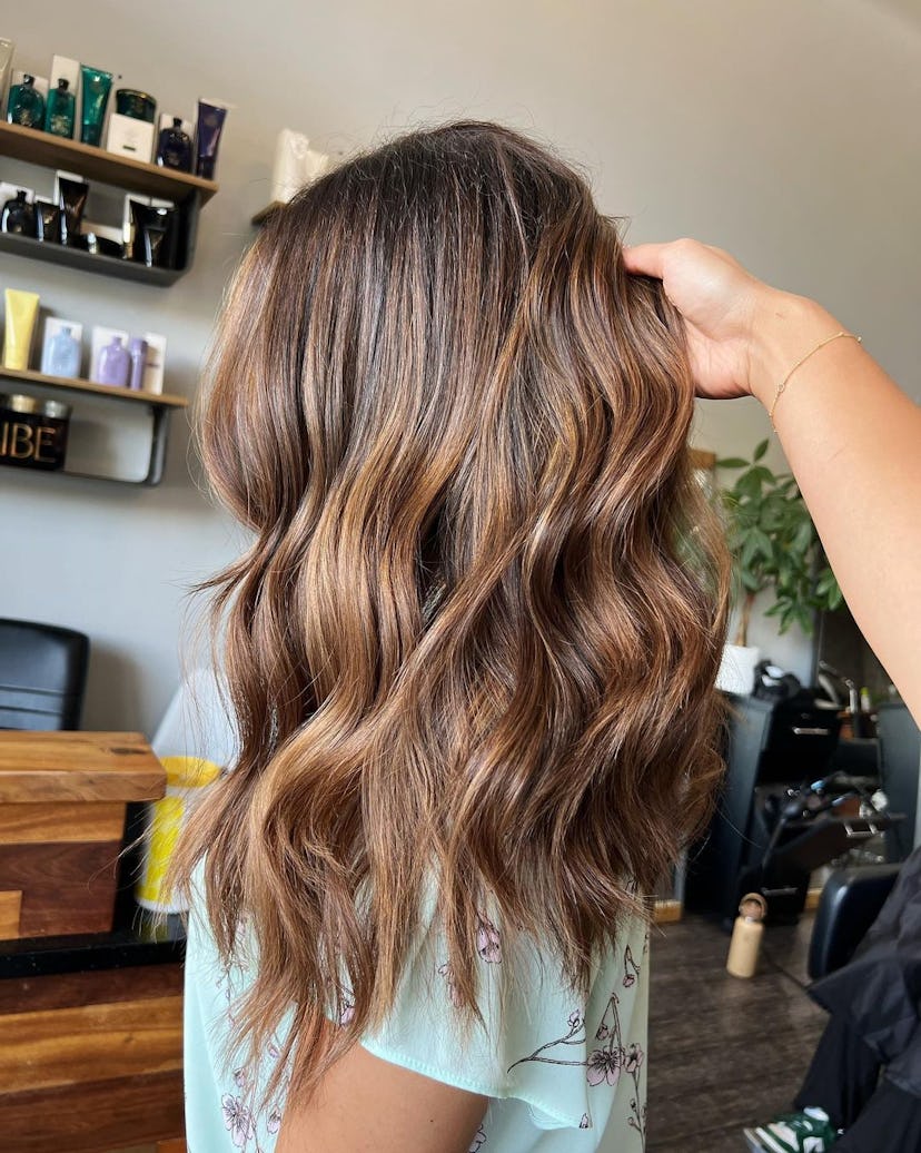 Caramel balayage is a popular winter hair color trend for 2024.