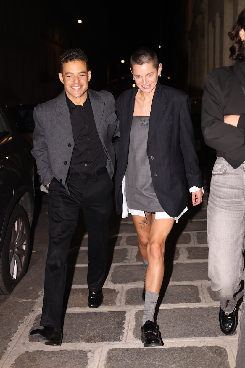 Emma Corrin & Rami Malek Make Things Official In Matching Power Suit Looks
