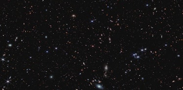 The striking, velvety black canvas of space is adorned with bright sparkling specks. They're scatter...