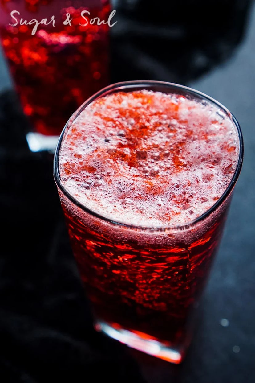 A spooky easy Halloween cocktail recipe, a red "blood and guts" themed drink