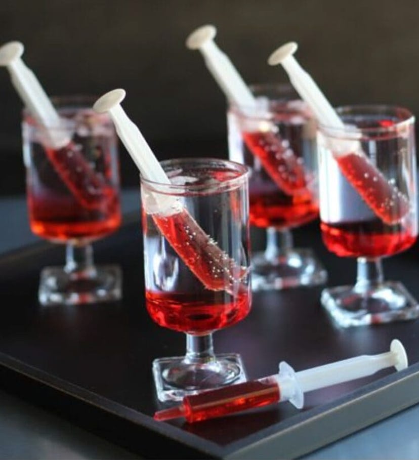 Shirley Temple Halloween mocktails, with the grenadine in a syringe to make them spooky.