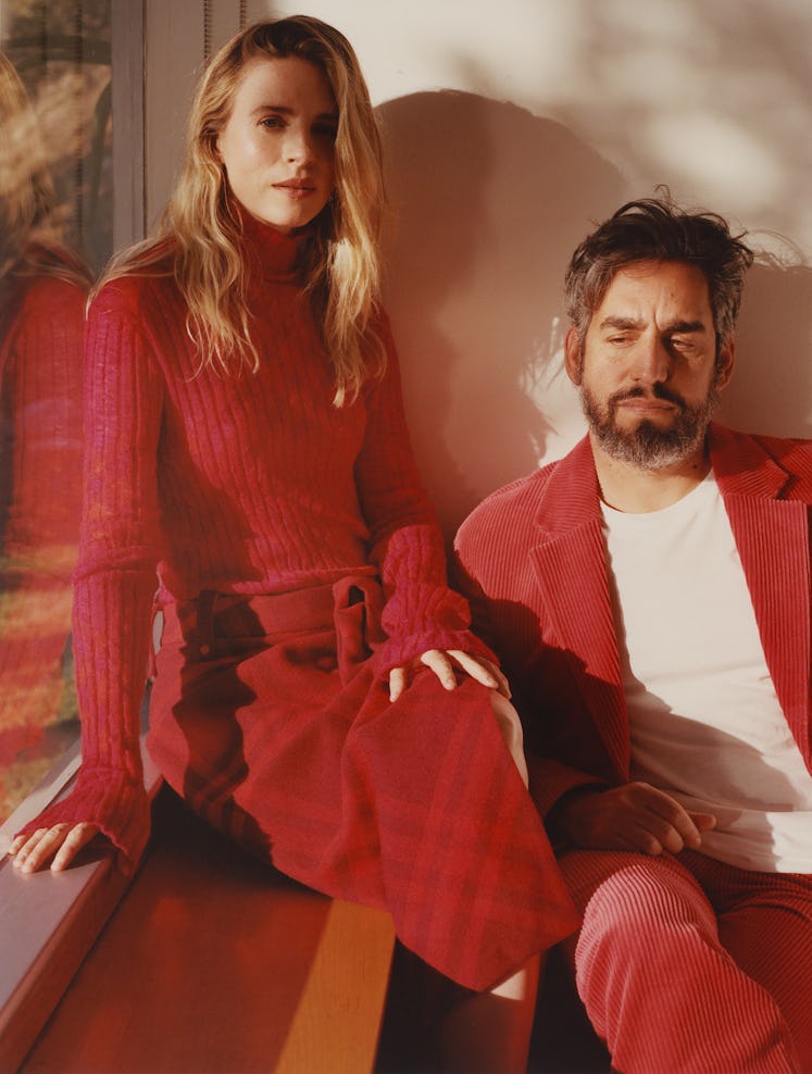 Brit Marling wears red turtleneck and red skirt. Zal Batmanglij wears a red blazer, white shirt and ...