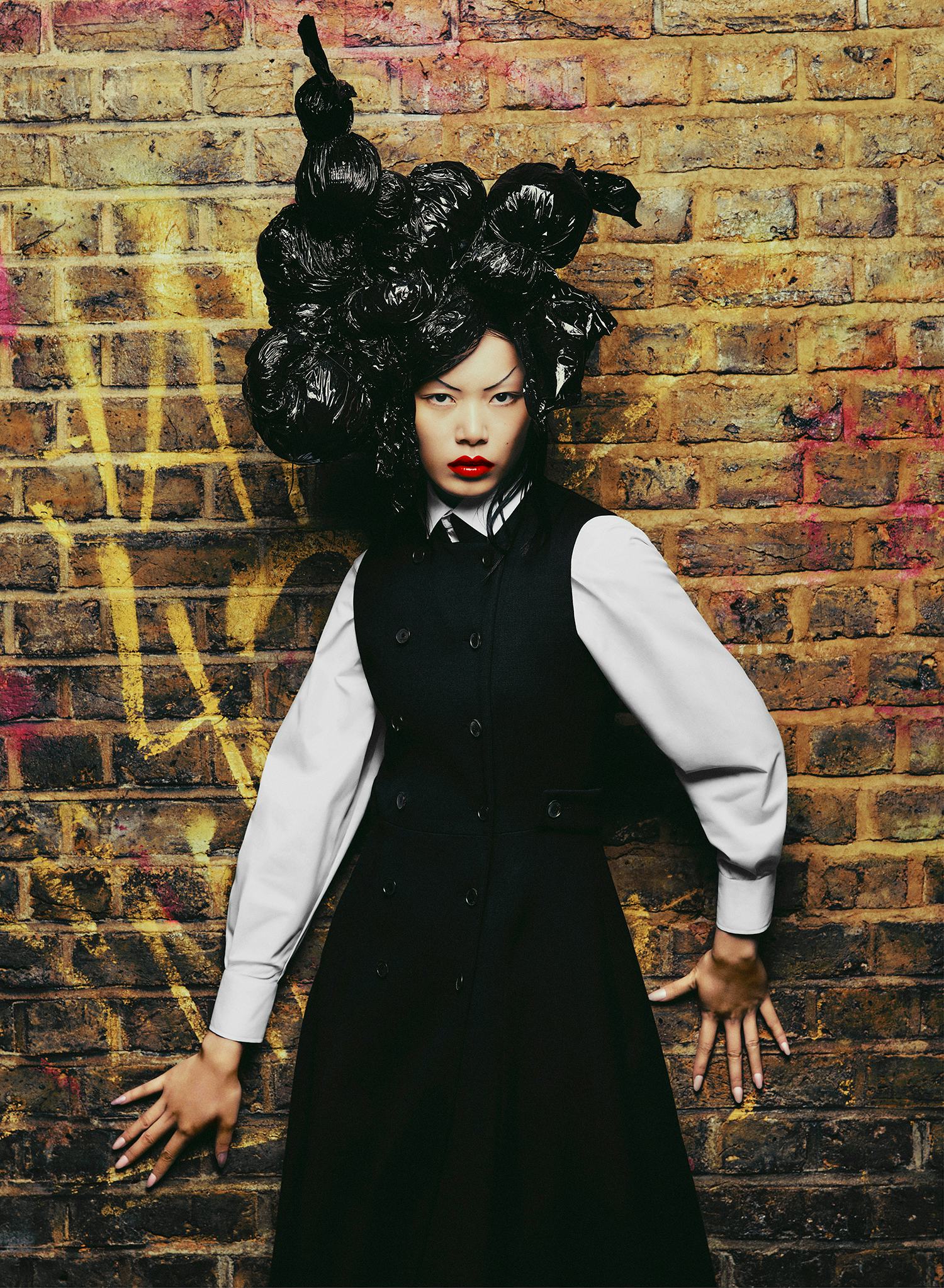 Liu wears a Dior black and white shirt.