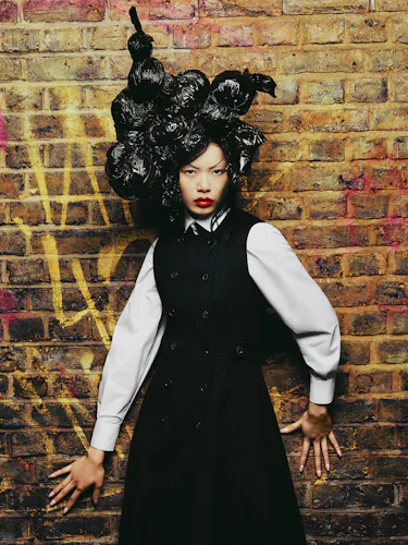 Liu wears a Dior black and white shirt.