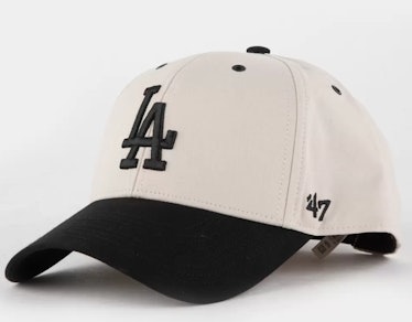 cream and black baseball cap