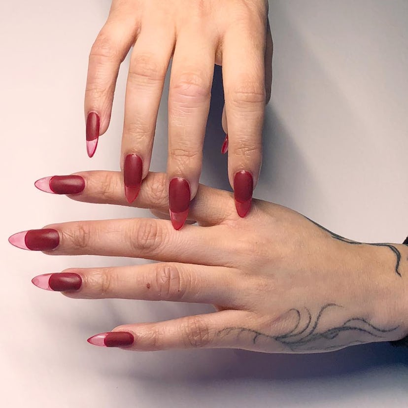 If you need ideas for vampire nails for Halloween 2023, try a simple translucent red nail design.