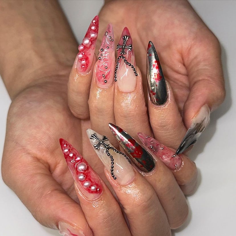 If you need ideas for vampire nails for Halloween 2023, try a trendy blood splatter nail design that...