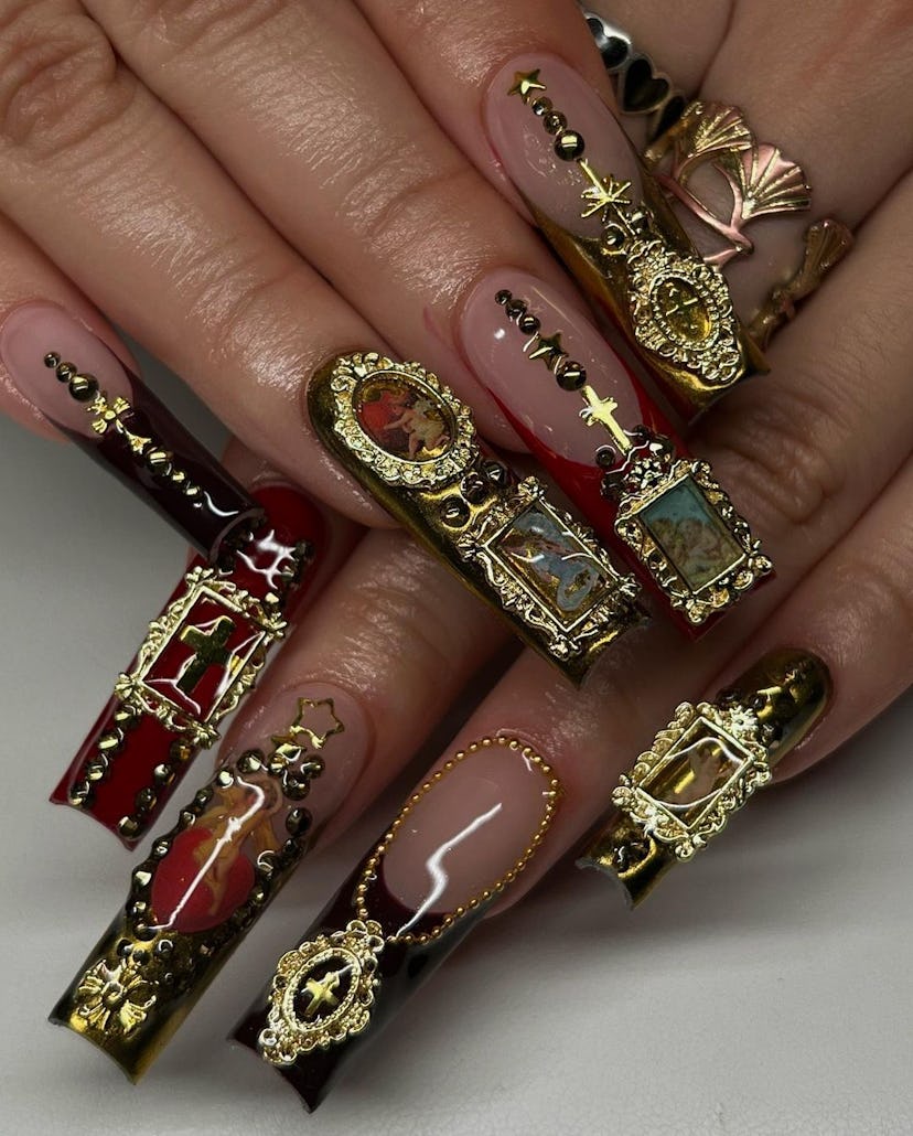 If you need ideas for vampire nails for Halloween 2023, try a 3D gold gothic nail design.