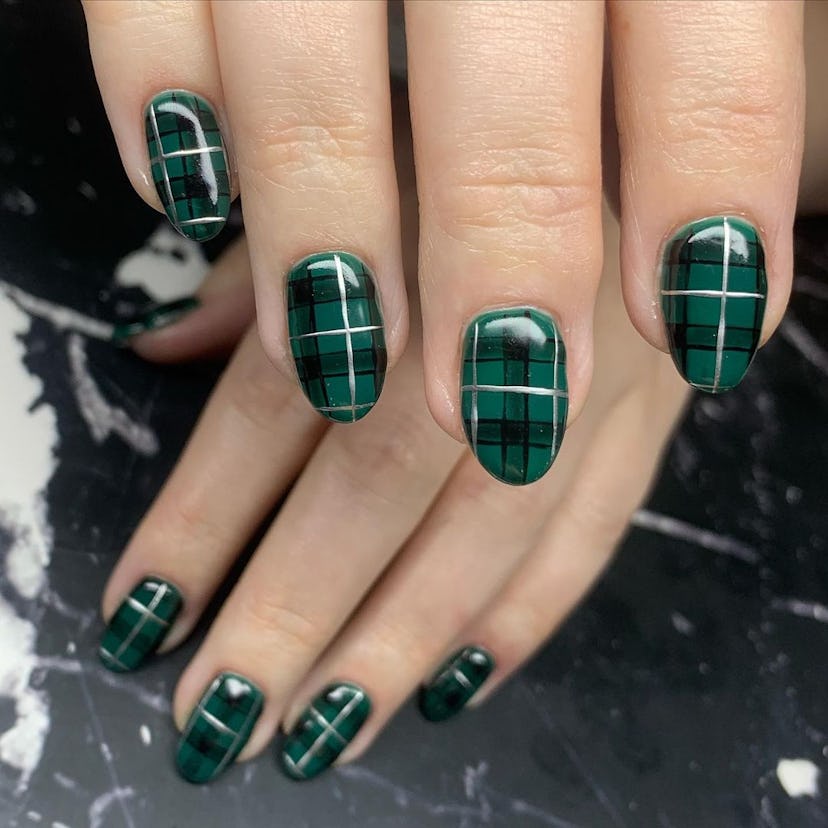 Emerald green plaid print nails match the dark academia aesthetic.