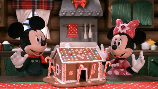 Mickey and Minnie in 'Mickey's Christmas Tales,' excited as a they build a gingerbread house.
