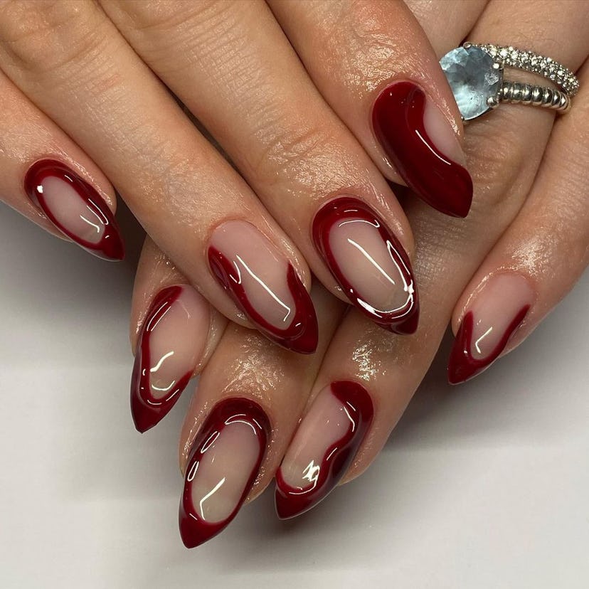 3D details painted in a "cherry mocha" nail polish hue matches the dark academia aesthetic.