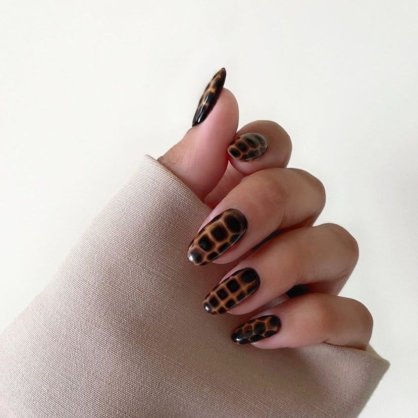 Dark chocolate croc print nails match the dark academia aesthetic.