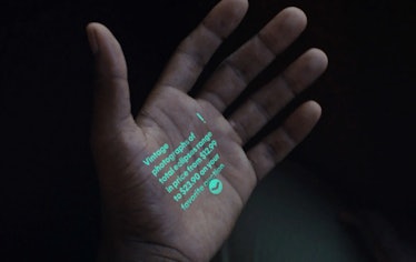 Text projected on a hand.